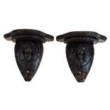 Pair of 19th Century carved dark oak wall brackets, each having mask head decoration Condition: