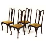 Set of four early 20th Century beech high back dining chairs, each having a carved and pierced