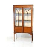 Edwardian inlaid mahogany display cabinet fitted three shelves enclosed by a pair of glazed doors