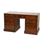 19th Century mahogany double pedestal kneehole desk having an inset leather writing surface and
