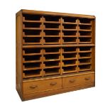 Large beech and oak haberdasher's cabinet, the upper sections fitted slides, the base fitted drawers