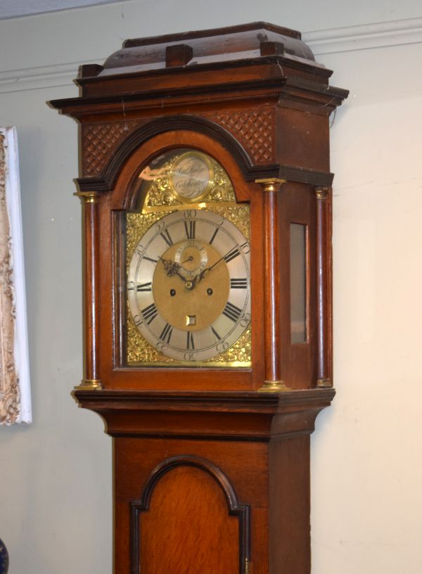 18th Century oak longcase clock by Nathaniel Hedge of Colchester, stepped hood having blind fret