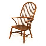 19th Century Windsor high back elbow chair having a hard seat and standing on turned supports united