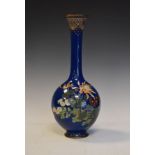 Japanese cloisonné slender baluster shaped vase having foliate decoration on a blue ground