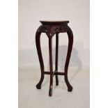 Chinese carved octagonal top plantstand having an inset marble panel, prunus decorated apron below