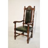 Large early 20th Century oak elbow chair, the carved crest rail bearing the emblem of the Rotary