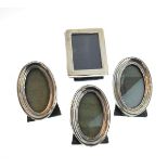 Set of three small George V oval silver picture frames, Birmingham 1918/1919, together with a modern