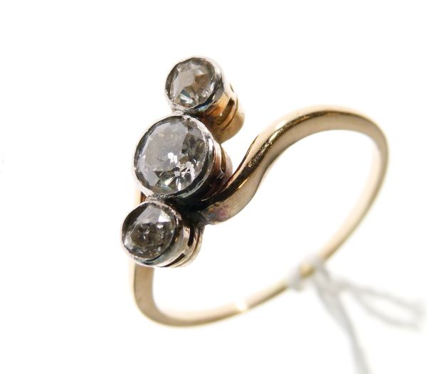 Gold coloured metal graduated three stone diamond ring, size O Condition: