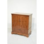 Reproduction yew wood finish tv cabinet fitted two doors with fall flap below Condition: