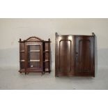 Mahogany serpentine front wall cabinet fitted two panelled doors and a mahogany finish wall
