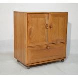 Ercol Golden Dawn tv cabinet, fitted two doors with fall flap below Condition:
