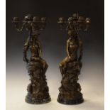 Pair of large reproduction bronze figural four branch candelabra, each decorated with a nymph seated