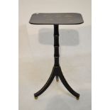 Ebonised Regency style tripod table, the rectangular top with gilt butterfly and floral decoration