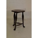Early 20th Century oak framed circular stool having an oyster veneered top and standing on triple