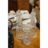 Pair of cut glass decanters and one other small similar