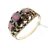 9ct gold dress ring set three graduated garnet coloured stones, size S Condition: