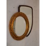 Mahogany framed shield shaped mirror and a circular gilt framed convex mirror Condition: