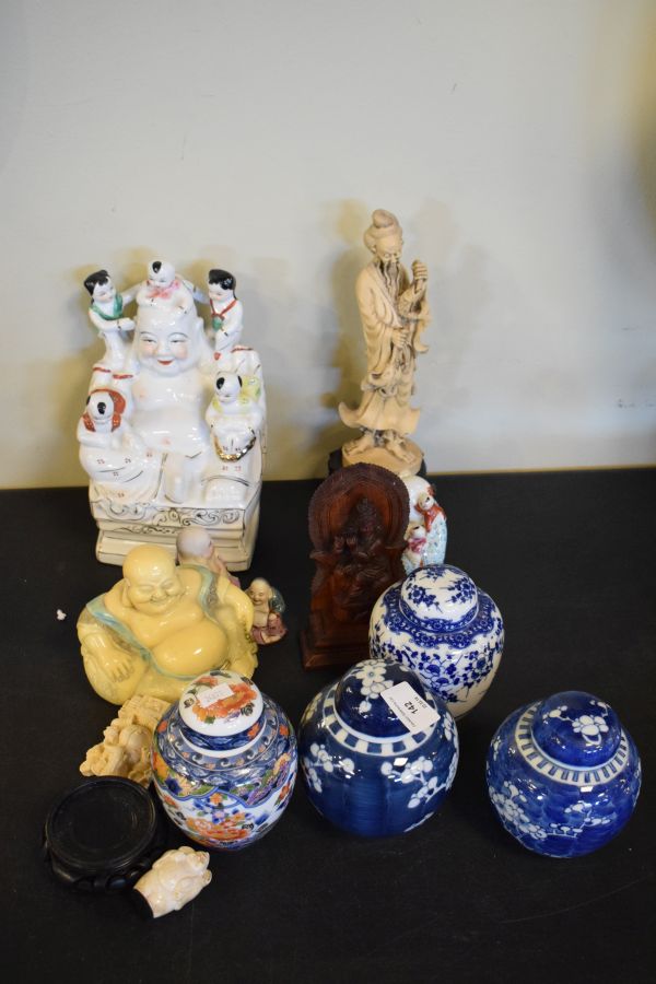 Four various ginger jars and covers, quantity of resin and pottery Buddhas, a carved wooden deity,