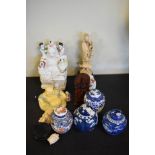 Four various ginger jars and covers, quantity of resin and pottery Buddhas, a carved wooden deity,