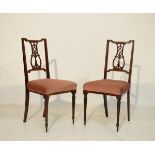 Pair of Edwardian crossbanded mahogany bedroom chairs standing on tapered turned and fluted supports