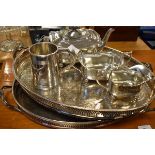 Silver plated three piece tea set, tankard and two oval galleried two handled tea trays Condition: