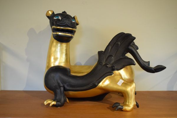 Modern ceramic figure of an oriental dragon decorated in black with gilt highlights Condition: