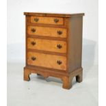 Reproduction burr walnut veneered bachelor's chest having fold-over top and fitted four long drawers