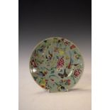 Chinese Famille Rose plate decorated with birds amongst foliage on a pale green ground Condition: