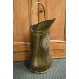 Dutch style brass coal hod with typical armorial decoration in relief Condition:
