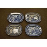 Four 19th Century blue and white transfer printed meat dishes, each decorated with the Willow