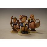 Three Goebel Hummel figures - Meditation, Apple Tree Boy and She Loves Me She Loves Me Not