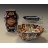 Nankin sauce boat having typical blue and white decoration, an Imari vase and a similar bowl