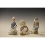 Three Lladro figures, each depicting a child with an animal Condition: