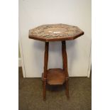 Early 20th Century carved oak octagonal top occasional table, standing on slender turned supports