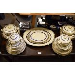 Large quantity of Newhall 'Fortuna' tableware having gilt decoration on a blue band Condition: