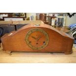1930's period oak cased striking and chiming mantel clock, having brass chapter ring with Arabic