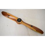 Late 20th Century wooden propeller clock with presentation inscription, 171cm wide Condition:
