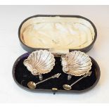Pair of Victorian silver scallop shaped salts having dolphin supports, Birmingham 1862, together