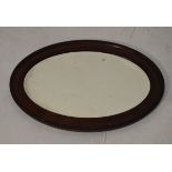 Early 20th Century oval mahogany framed bevelled mirror Condition: