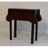 Small George III mahogany two flap supper table having shaped flaps and standing on moulded square