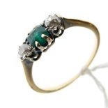 Gold coloured metal dress ring set two diamonds flanking an emerald coloured stone, size M
