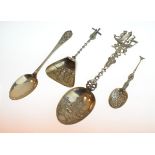 Three decorative Continental white metal spoons, each having an embossed bowl, together with a