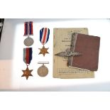 Four World War II medals, filigree white metal R.A.F. brooch, army release book and service/pay book