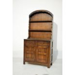 Reproduction oak dresser, the plate rack fitted two shelves, the base fitted two drawers with