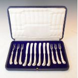 Six pairs of silver handled Pistol pattern tea knives and forks, cased Condition: