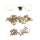 Three 9ct gold chains, two 9ct gold rings and a gold coloured metal ring Condition: