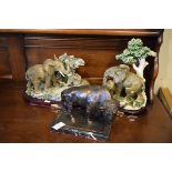 Modern bronzed metal figure of a bison, together with two resin figure groups - Elephants Condition: