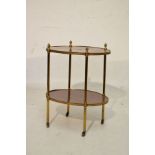 Late 19th/early 20th Century French brass framed mahogany oval two tier occasional table having