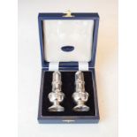 Pair of Elizabeth II silver baluster pepperettes, Birmingham 2000, 3.6oz approx, cased Condition: