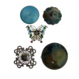 White metal and blue enamel decorated circular brooch, Scottish hardstone brooch and one other